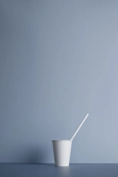 White paper cups isolated on gray — Stock Photo, Image