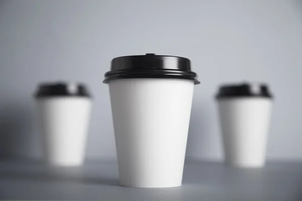 Three take away white paper cups — Stock Photo, Image