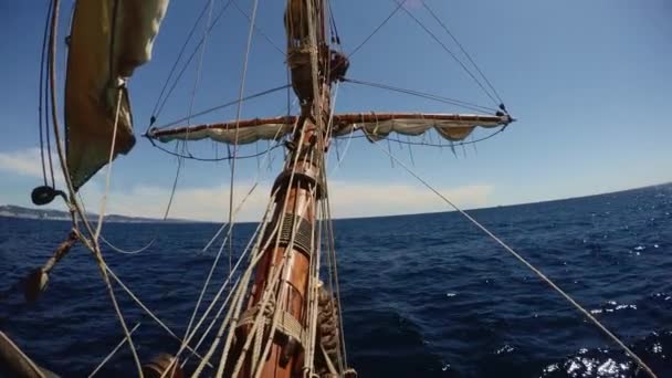 Old vintage sailing ship waving in deep blue sea — Stock Video