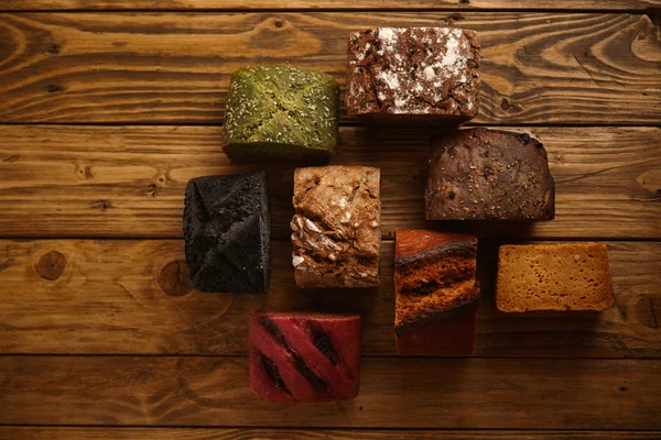 Mixed alternative baked breads on table — Stock Photo, Image