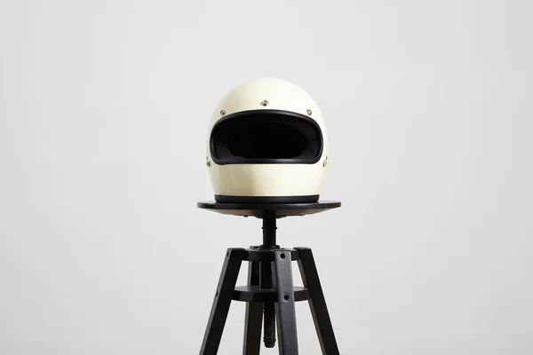 Motorbike helmet on chair frontside — Stock Photo, Image