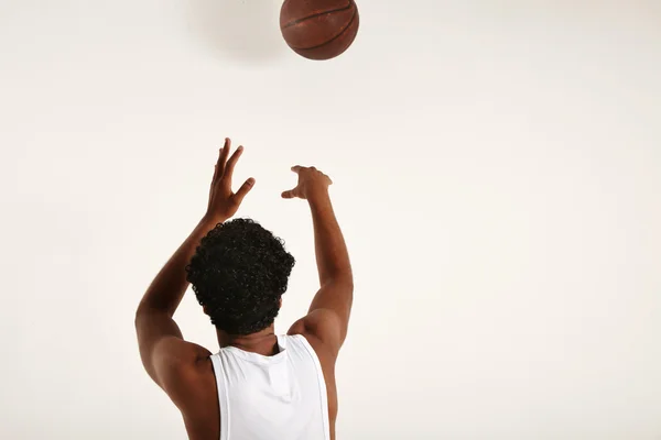 Handsome young African American throwing basketball — Stock Photo, Image