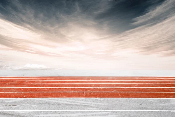 Low angle side shot of a running track, orange — Stock Photo, Image