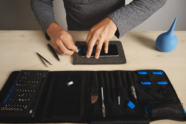 Man uses vacuum plug and plastic opener