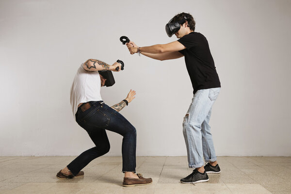 Two men fighting in VR glasses