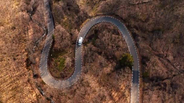 Cinematic drone shot of camper van on scenic road — Stock Video