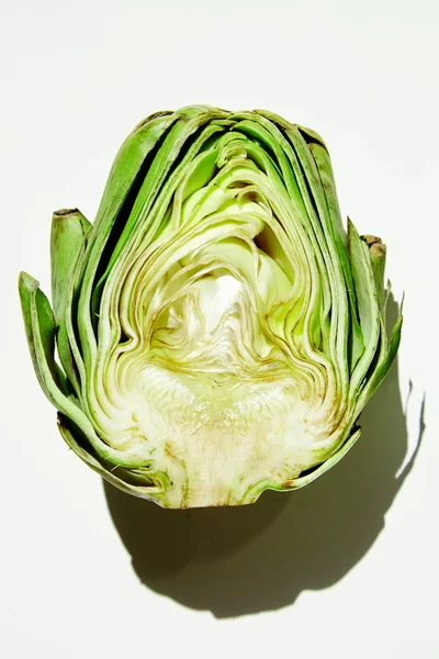 Half splitted artichocke in hard sun light — Stock Photo, Image