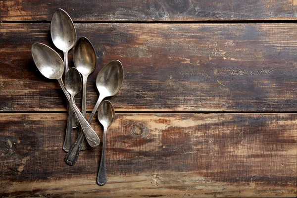 Vinage spoons on a wooden table — Stock Photo, Image