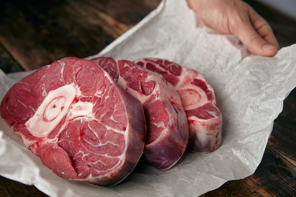 Closeup of three cosher meat steaks with bone for dinner — Stock Photo, Image