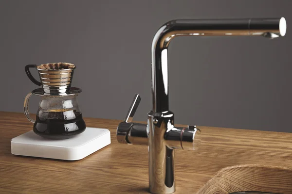 Drip japanese coffee maker behinf silver tap