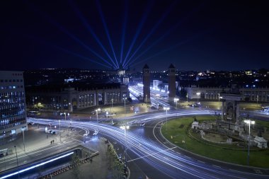 Night on city junction with light trails