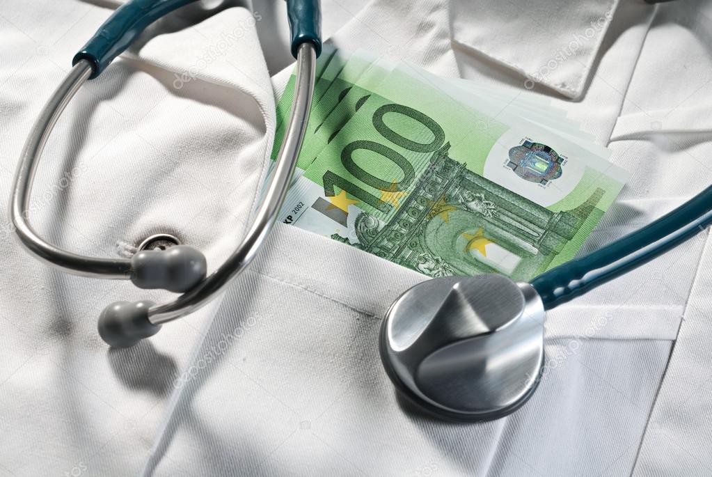 Stethoscope and money bills on a doctor's coat
