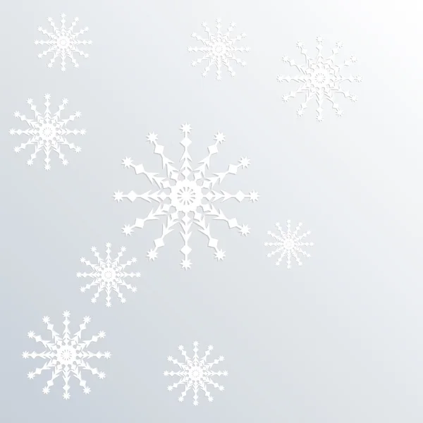 Hafif bir arka plan üzerinde kağıt kar taneleri