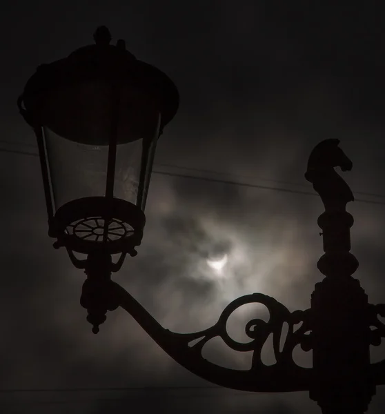 Eclipse seen through the clouds — Stock Photo, Image