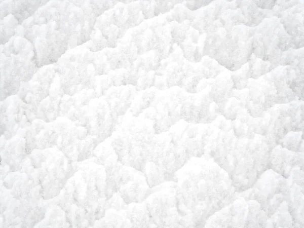 Die weiße Textur des Schnees ist rau und locker. Vollbild-Foto — Stockfoto