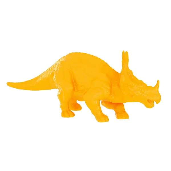 Dinosauro giocattolo giallo in plastica su uno sfondo isolato. rendering 3d — Foto Stock