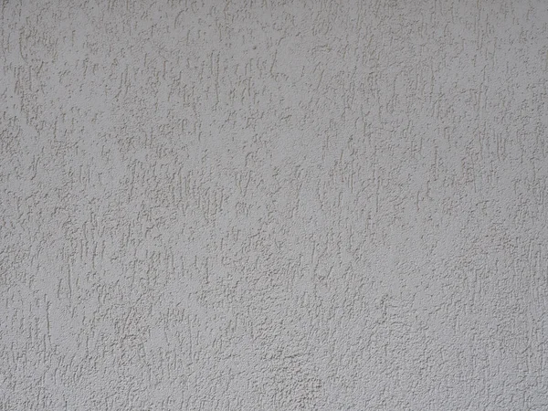 Gri kabartmalı dekoratif kaplamalı duvar. Doku pürüzsüz değil. Tam ekran fotoğrafı — Stok fotoğraf