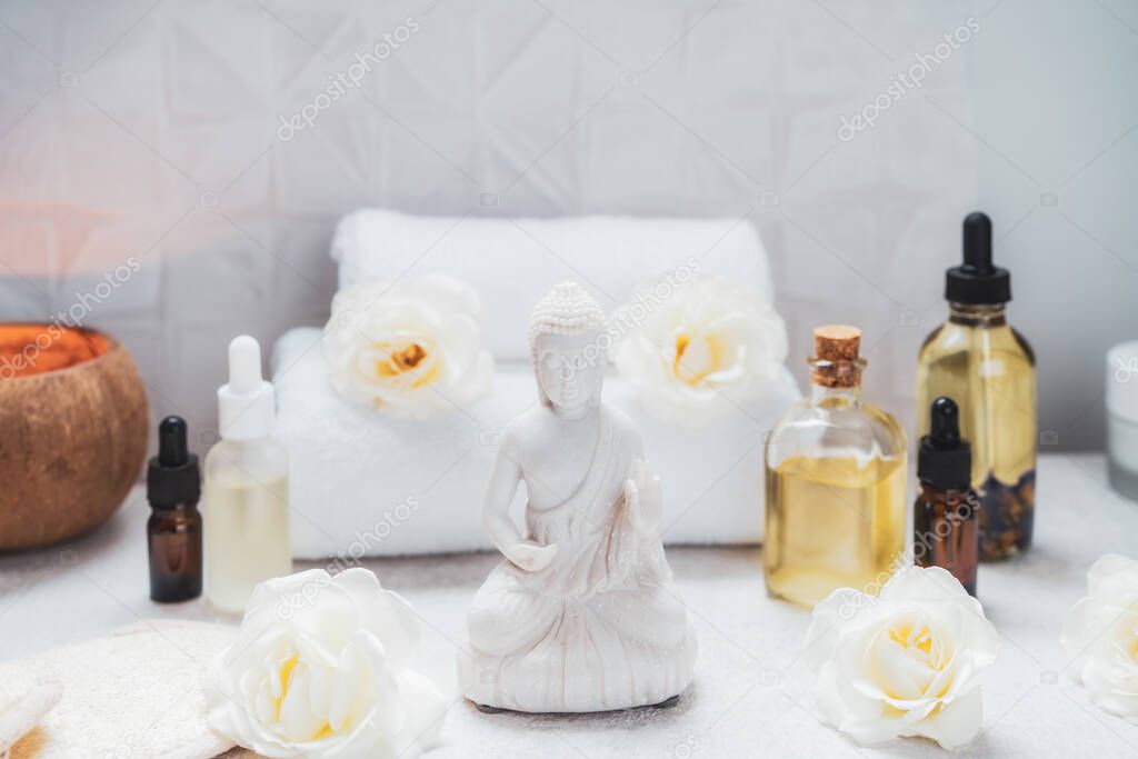 Spa and wellness massage setting. Concept of Asian relaxing spa procedure with essential oils. Alternative medicine and body care. Selective focus. copy space