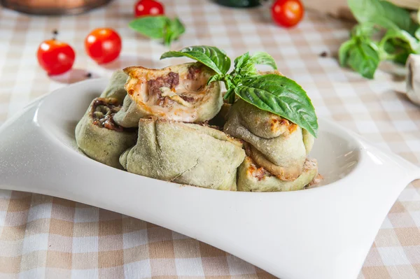 Delesious warm veal rolls on the spinach dough — Stock Photo, Image