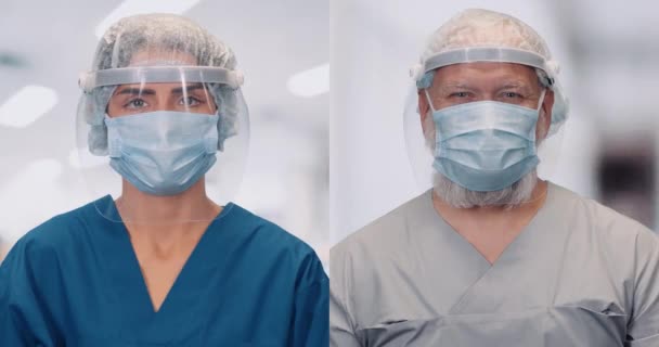 Porträtt av läkare i skyddsutrustning och medicinska masker, delad skärm, kvinna och vuxen man i en plast visir tittar på kameran, skydd mot ett coronavirus, sjukhus suddig bakgrund — Stockvideo