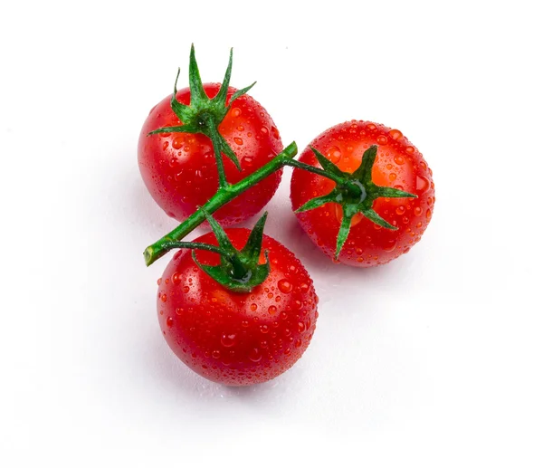 Três tomates cereja em videira isolada em branco — Fotografia de Stock