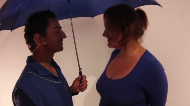 Woman Jumping undet the Mans Umbrella — Stock Video