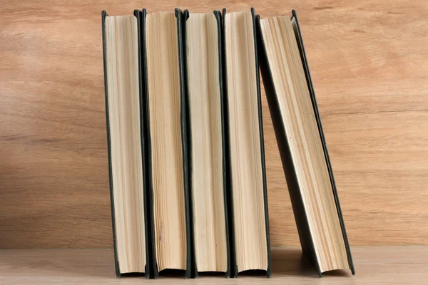 Stack of books on wooden background — Stock Photo, Image