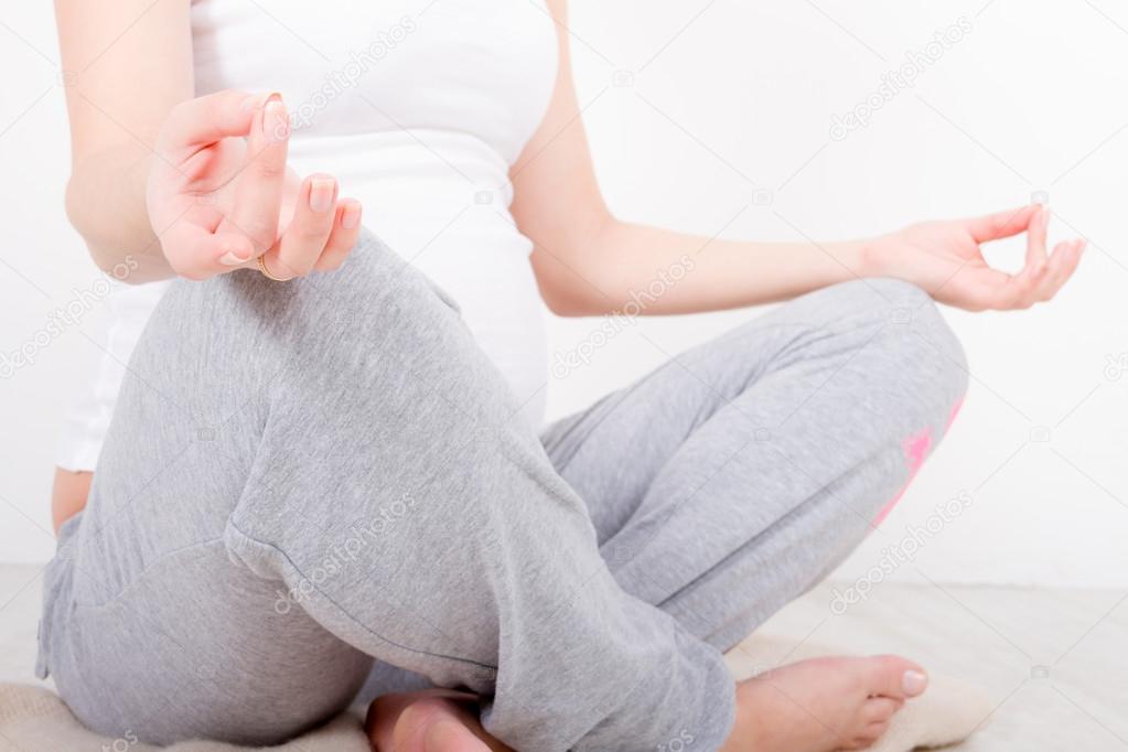 Young pregnant woman doing exersice