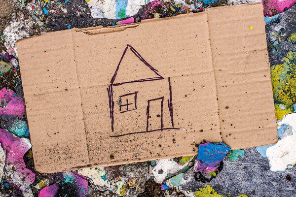 Sign of homeless man on cardboard