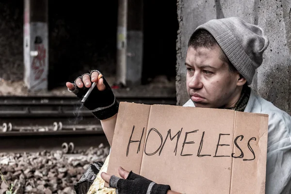 Homeless woman smoking — Stock Photo, Image