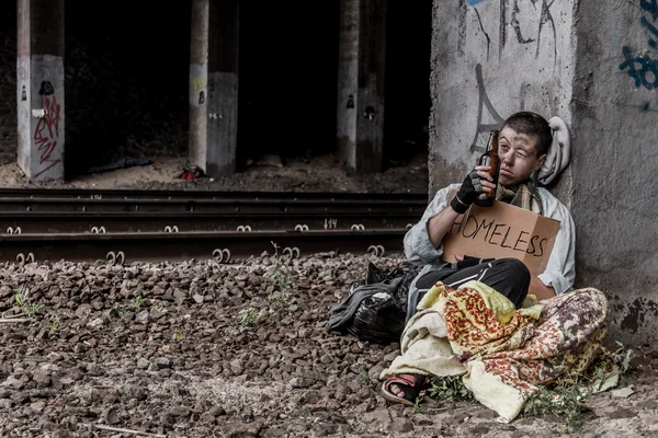 Homeless woman near the rail track — Stock Photo, Image