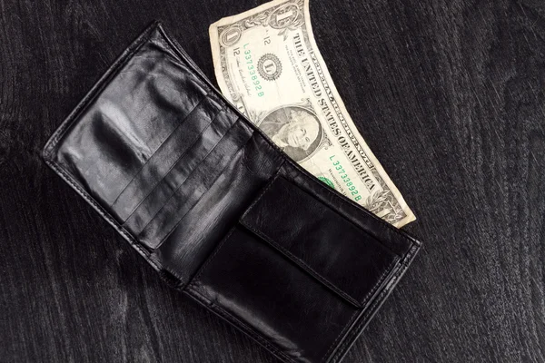黑色皮革钱包，一元。概念: 贫穷 — 图库照片