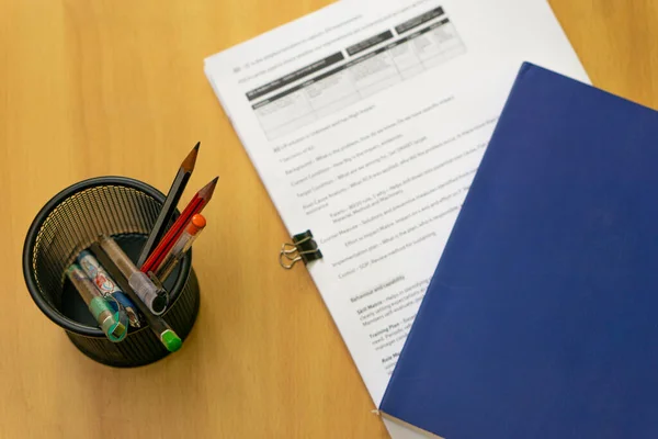 Office table with notepad and papers