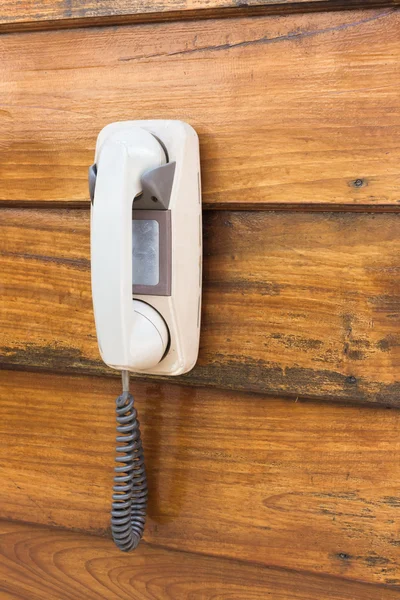 Older telephone hanging on wall. — Stock Photo, Image