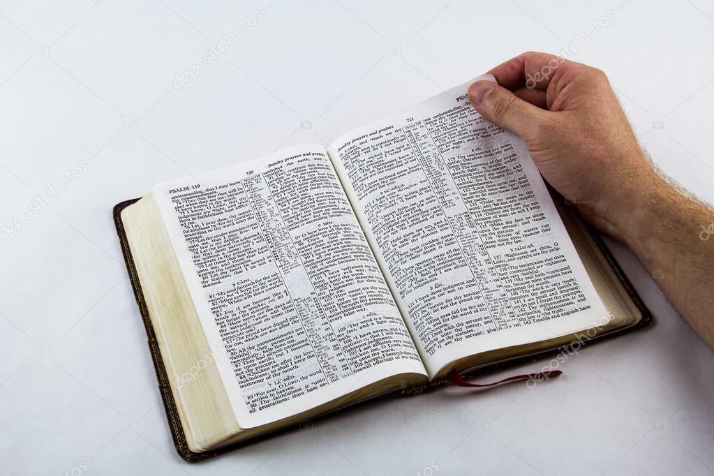 Reading a Bible on White Background