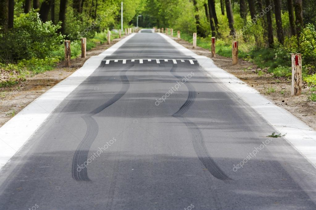 skid marks in front of speed bump stock photo kievith 84271062