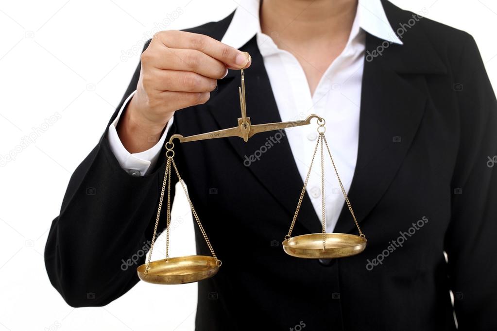 Businesswoman holding the justice scale