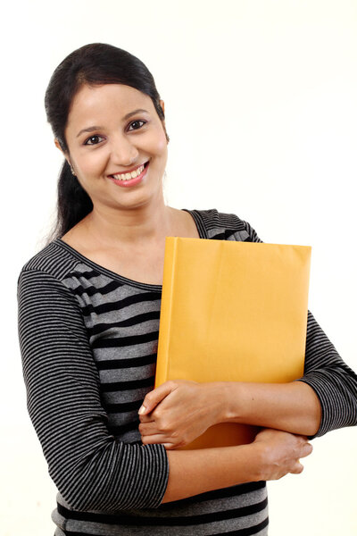 Студентка с книгами в руках
