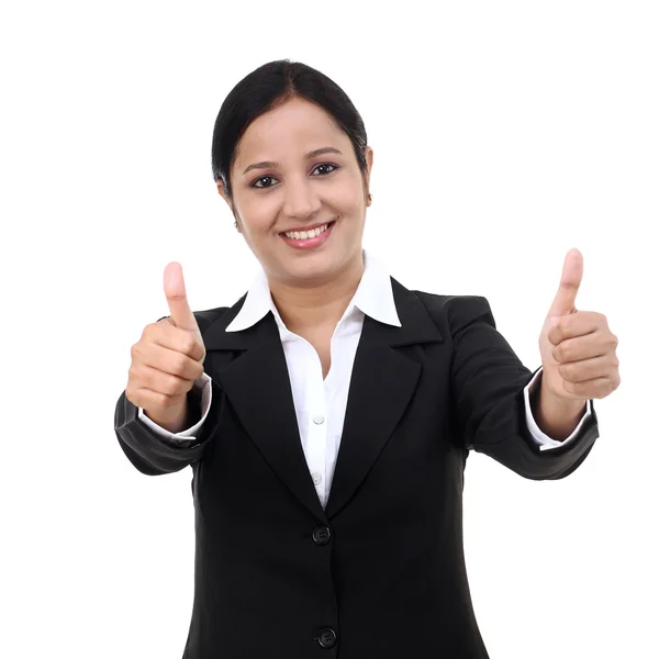 Cheerful woman with thumbs up against white background — Stock Photo, Image