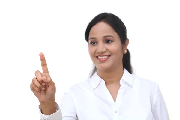 Young businesswoman touching virtual screen — Stock Photo, Image