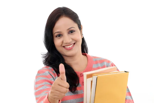 Cheerful female student with thumbs up gesture — Stock Photo, Image