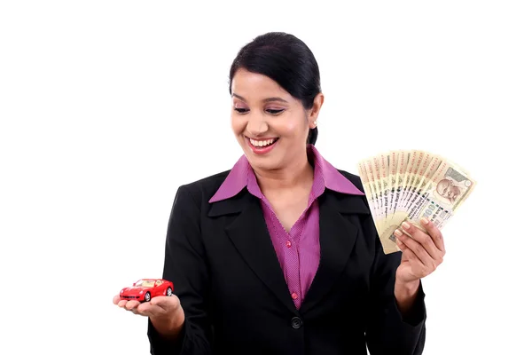 Mujer alegre de negocios con dinero y coche de juguete —  Fotos de Stock