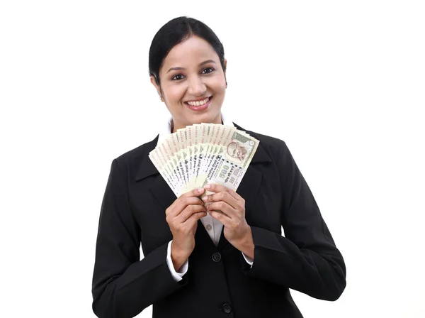 Young business woman holding Indian currency notes — Stock Photo, Image