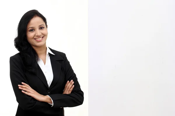 Happy business woman showing blank signboard — Stock Photo, Image