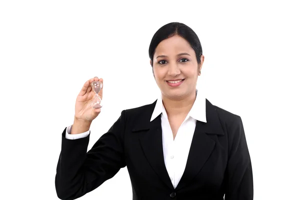 Business woman holding hourglass — Stock Photo, Image