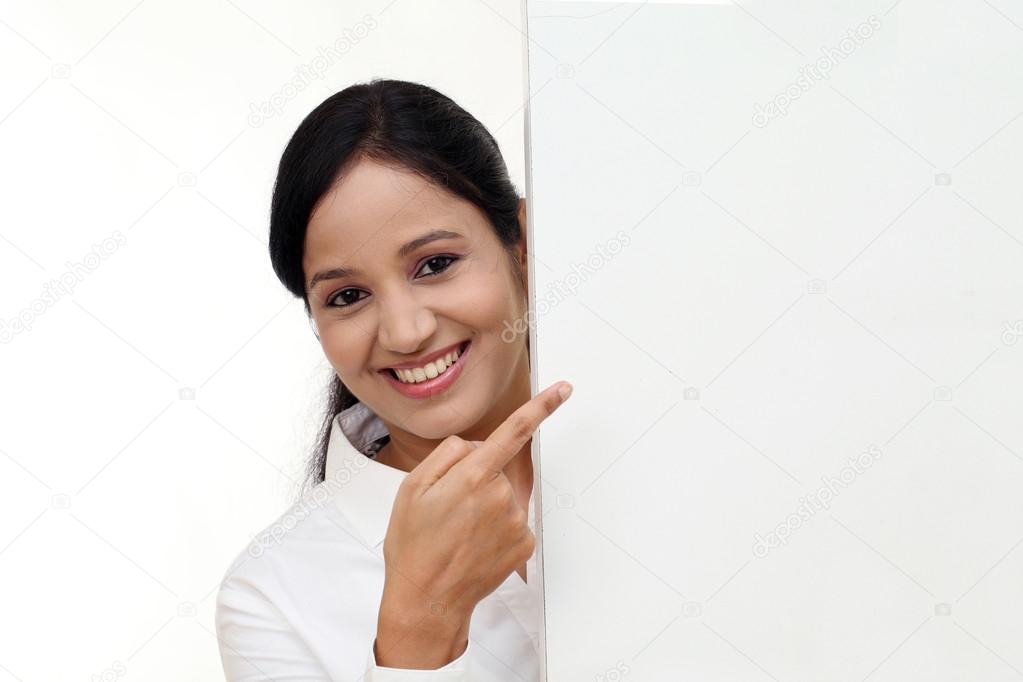 Business woman showing blank signboard