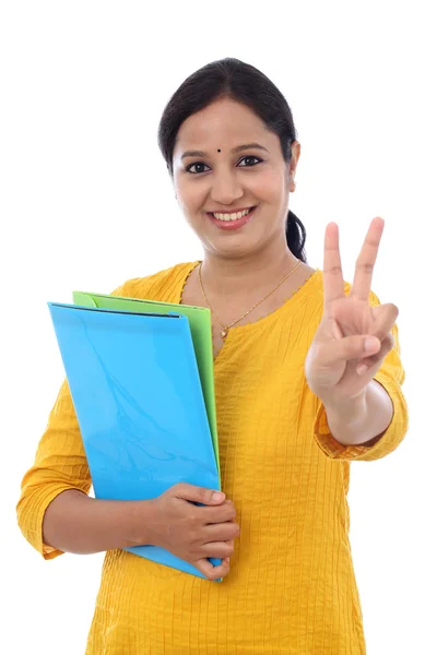 Happy female student with victory gesture — Stock Photo, Image