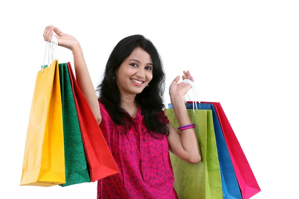 Joven feliz mujer sonriente con bolsas de compras —  Fotos de Stock