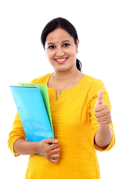 Young happy woman with blue folderand making thumbs up gesture — Stock Photo, Image