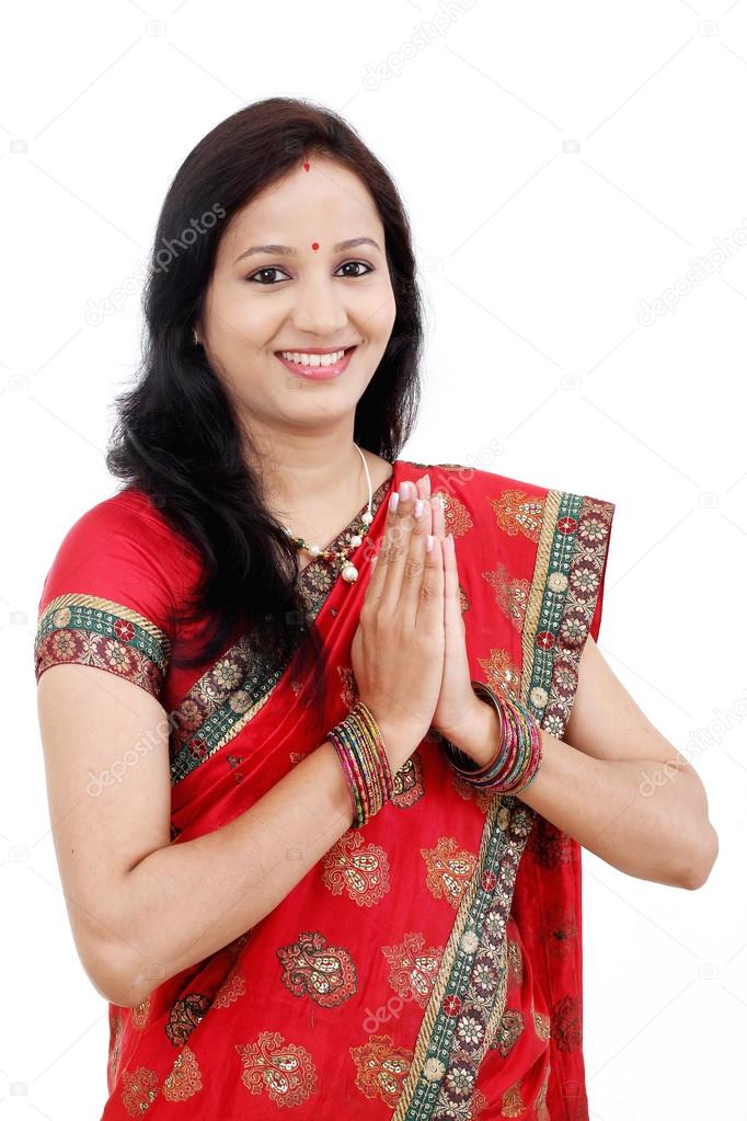 Traditional Indian woman holding hands in prayer position